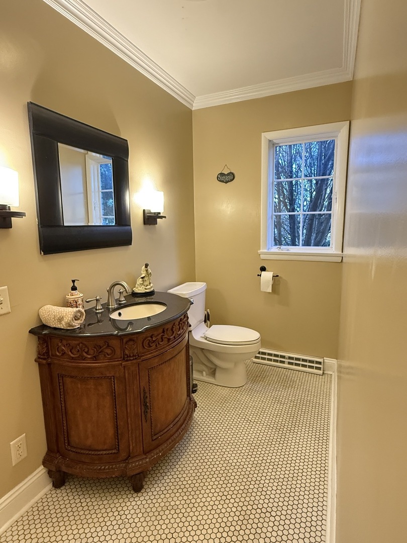 402 West Le Fevre Road Sterling, IL 61081 - Photo 15 of 39 a bathroom with a granite countertop toilet sink and mirror