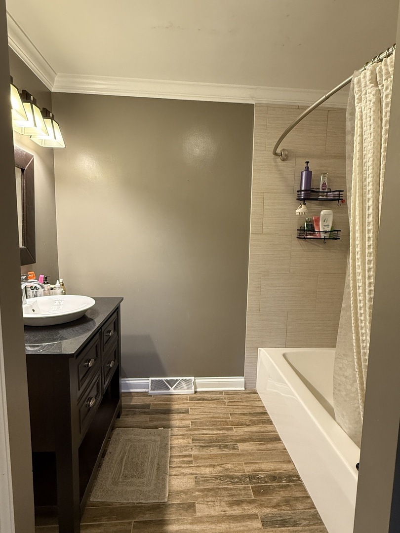 402 West Le Fevre Road Sterling, IL 61081 - Photo 25 of 39 a bathroom with a sink and a mirror