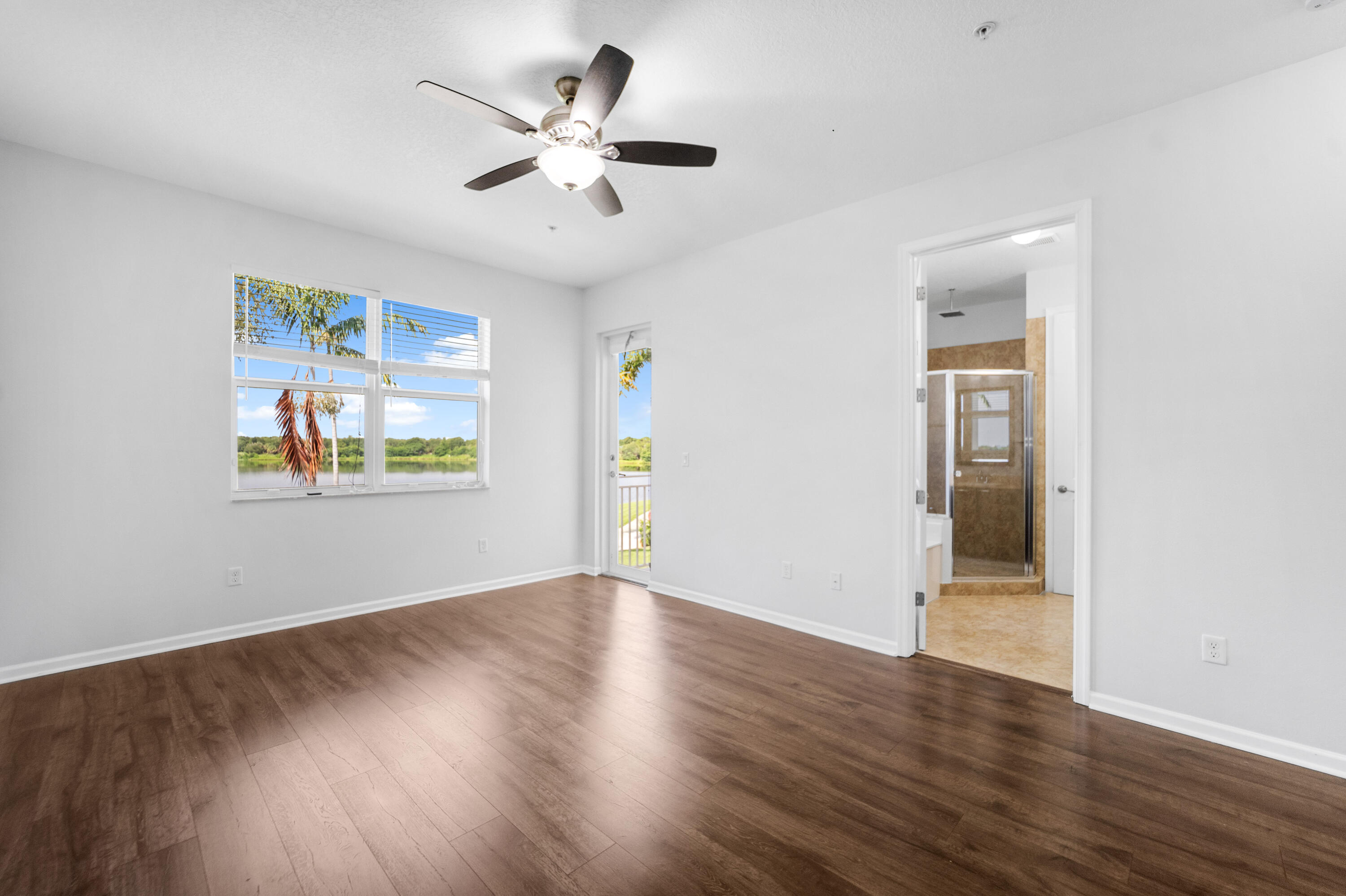 1430 Northwest 48th Lane Boca Raton, FL 33431 - Photo 26 of 54 a view of an empty room with wooden floor