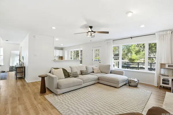 a living room with furniture and a large window
