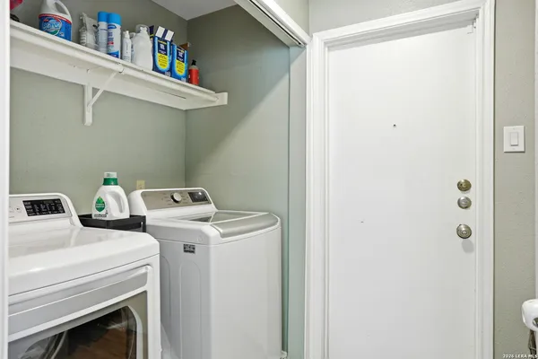 a view of a house with lounge chair and wooden floor