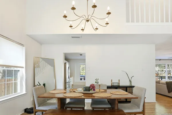 a view of a dining room with furniture and wooden floor