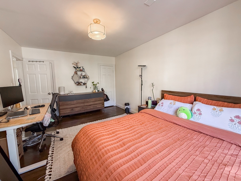 84 Strathmore Road, Unit 4 Boston, MA 02135 - Photo 11 of 14 a bedroom with two beds and a desk