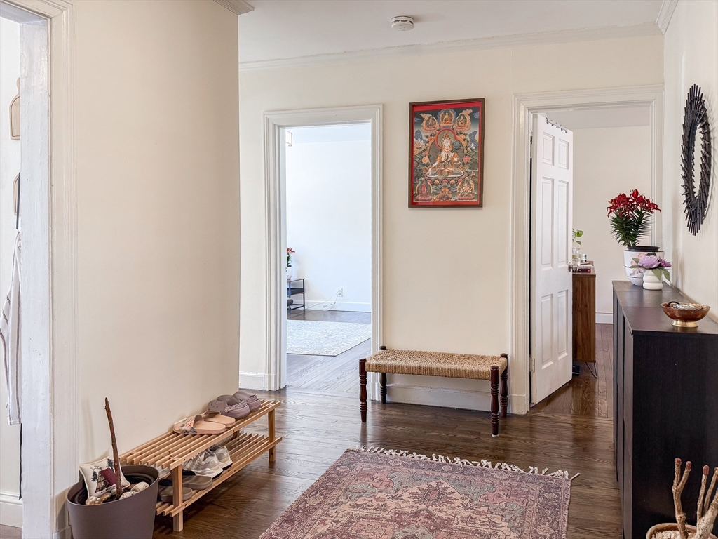 84 Strathmore Road, Unit 4 Boston, MA 02135 - Photo 13 of 14 a living room with furniture and wooden floor