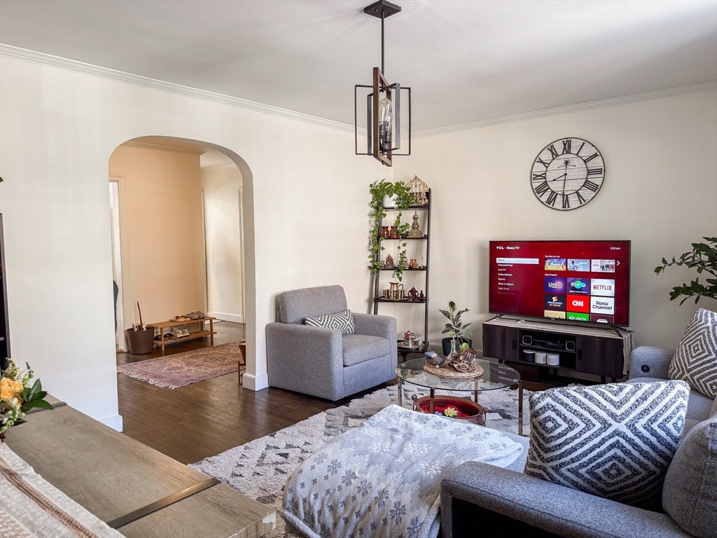 84 Strathmore Road, Unit 4 Boston, MA 02135 - Photo 5 of 14 a living room with furniture and a flat screen tv