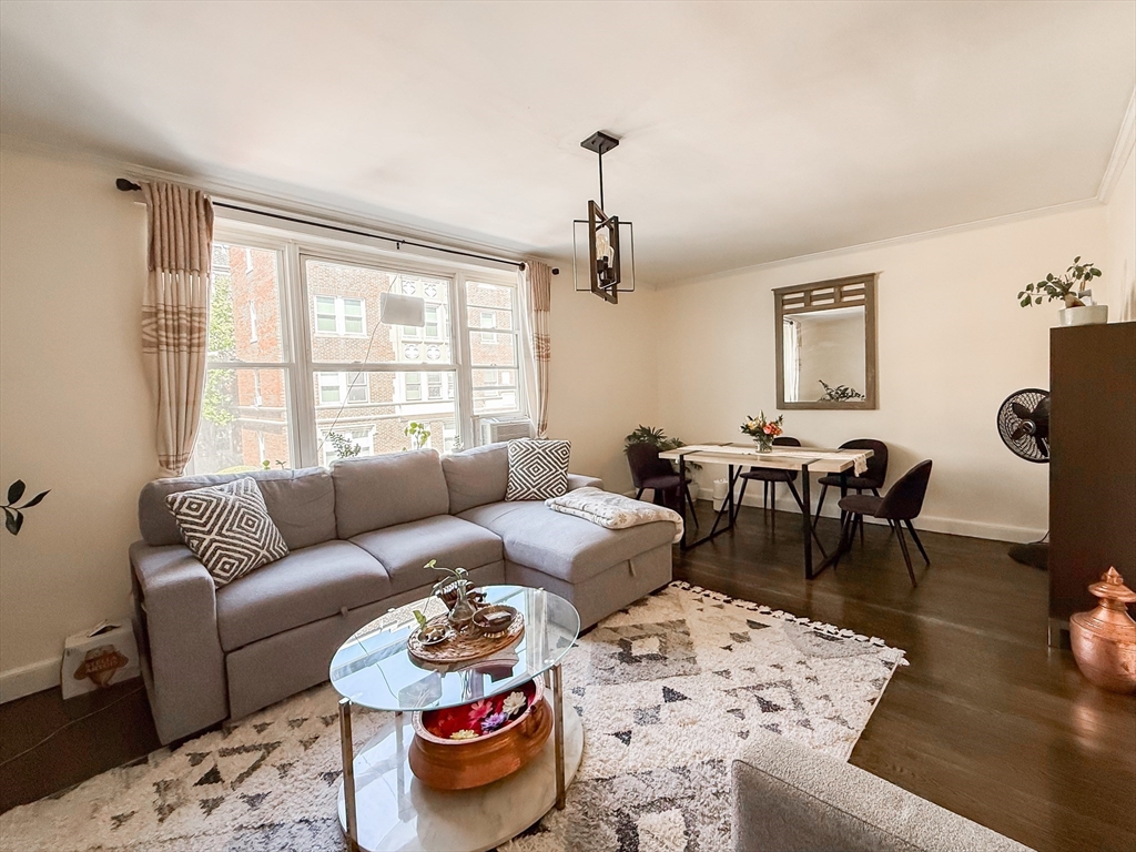 84 Strathmore Road, Unit 4 Boston, MA 02135 - Photo 6 of 14 a living room with furniture and a table