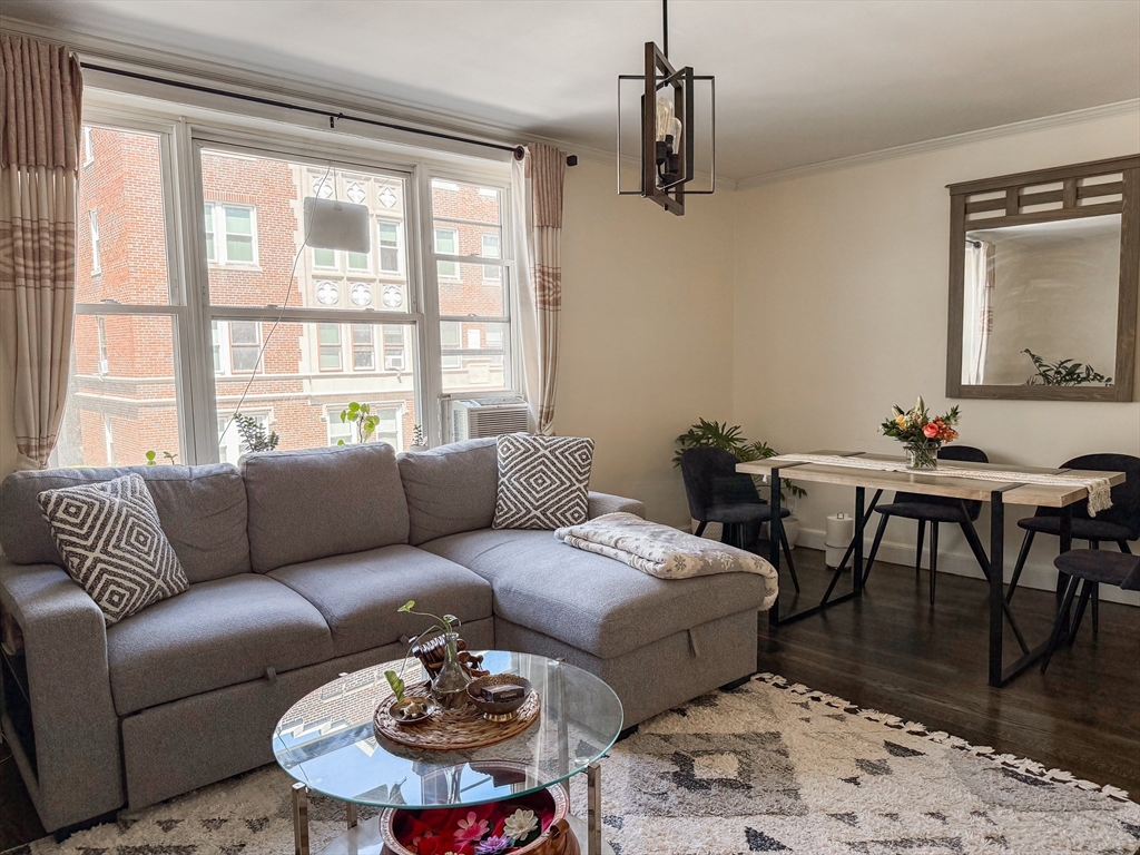 84 Strathmore Road, Unit 4 Boston, MA 02135 - Photo 7 of 14 a living room with furniture a rug and a window