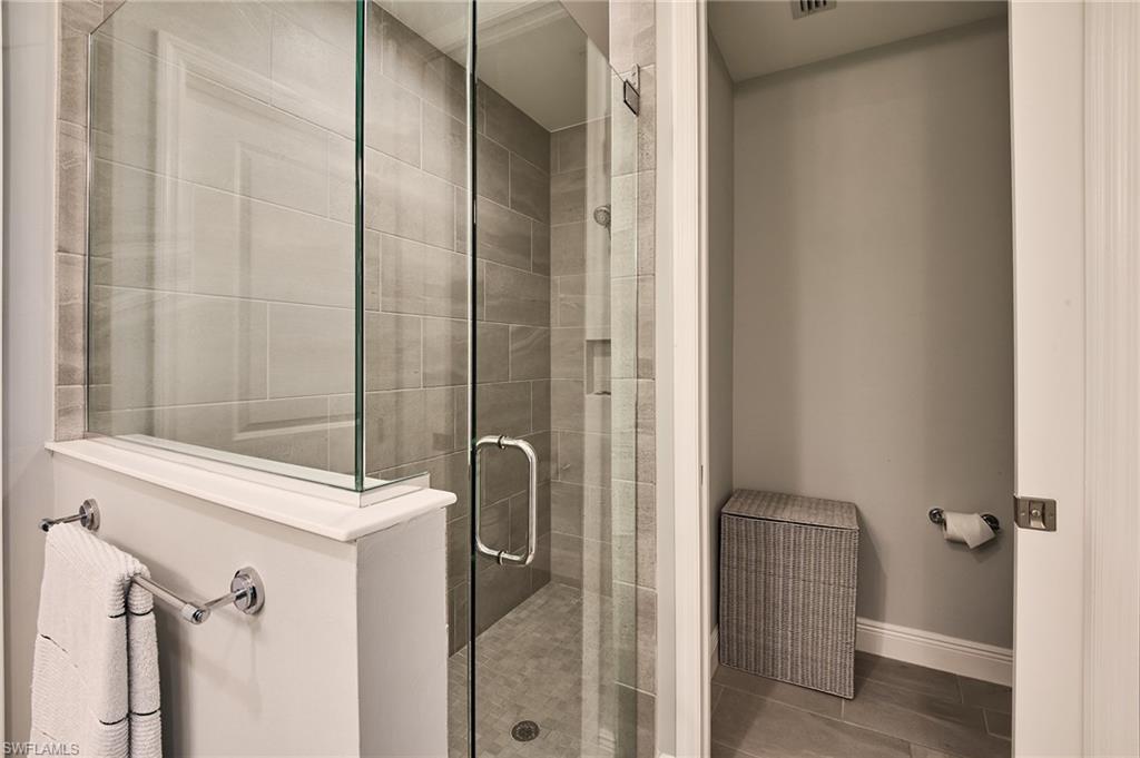 2664 Seychelles Circle, Unit 2402 Naples, FL 34112 - Photo 11 of 30 a bathroom with a shower