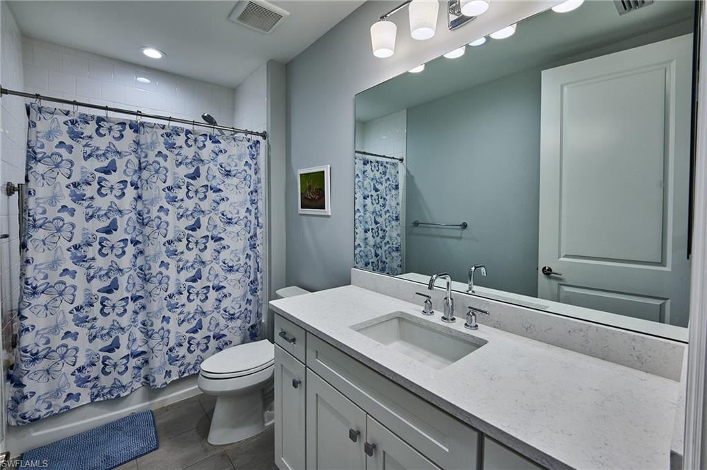 2664 Seychelles Circle, Unit 2402 Naples, FL 34112 - Photo 15 of 30 a bathroom with a sink toilet and shower