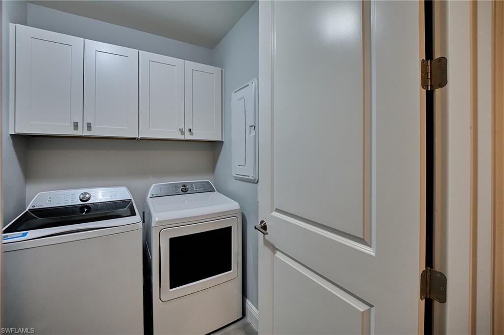 2664 Seychelles Circle, Unit 2402 Naples, FL 34112 - Photo 18 of 30 a utility room with dryer and washer