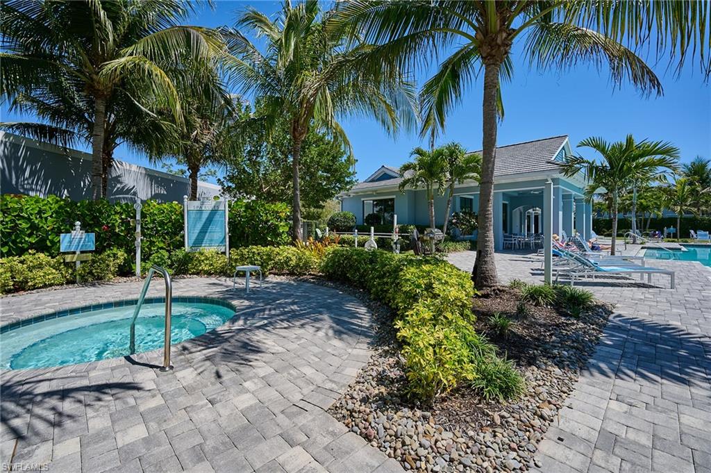 2664 Seychelles Circle, Unit 2402 Naples, FL 34112 - Photo 20 of 30 a view of a yard with a house