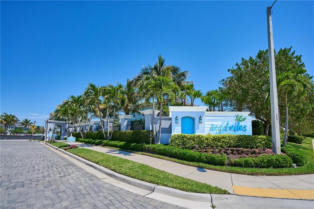 2664 Seychelles Circle, Unit 2402 Naples, FL 34112 - Photo 2 of 30 a view of a house with a yard