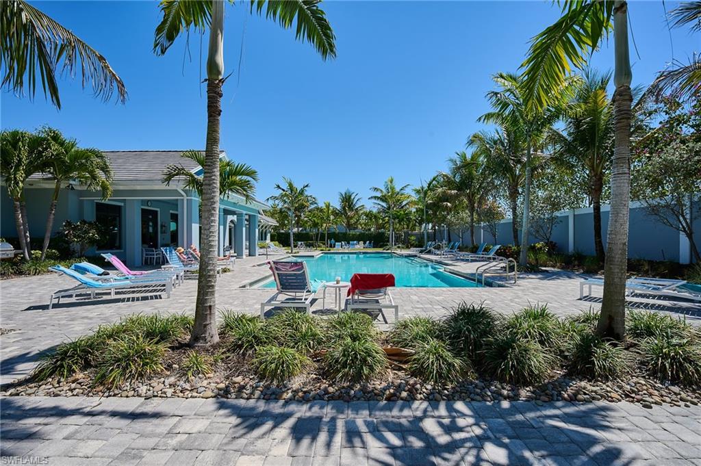 2664 Seychelles Circle, Unit 2402 Naples, FL 34112 - Photo 22 of 30 a garden view with a seating space