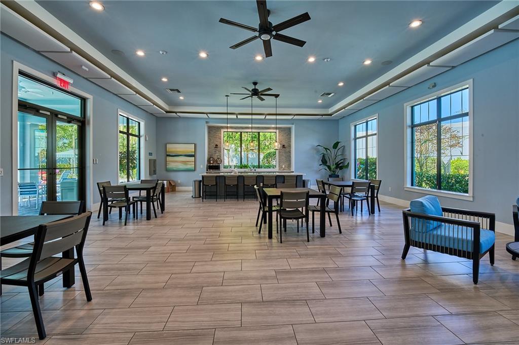 2664 Seychelles Circle, Unit 2402 Naples, FL 34112 - Photo 25 of 30 a view of a dining room with furniture window and outside view