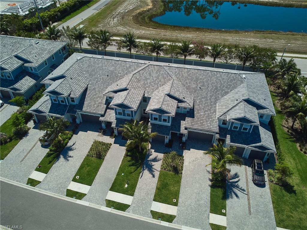 2664 Seychelles Circle, Unit 2402 Naples, FL 34112 - Photo 29 of 30 an aerial view of a house with a yard