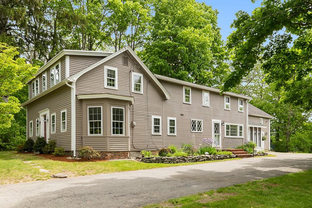 41 Old Ayer Road Groton, MA 01450 - Photo 1 of 38 a front view of a house with a yard and garage
