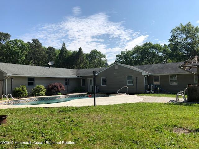 330 Eleanor Road Forked River, NJ 08731 - Photo 26 of 35 a front view of a house with a yard and trees