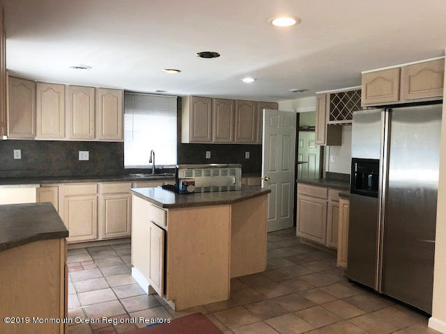 330 Eleanor Road Forked River, NJ 08731 - Photo 6 of 35 a kitchen with stainless steel appliances granite countertop a refrigerator and a stove