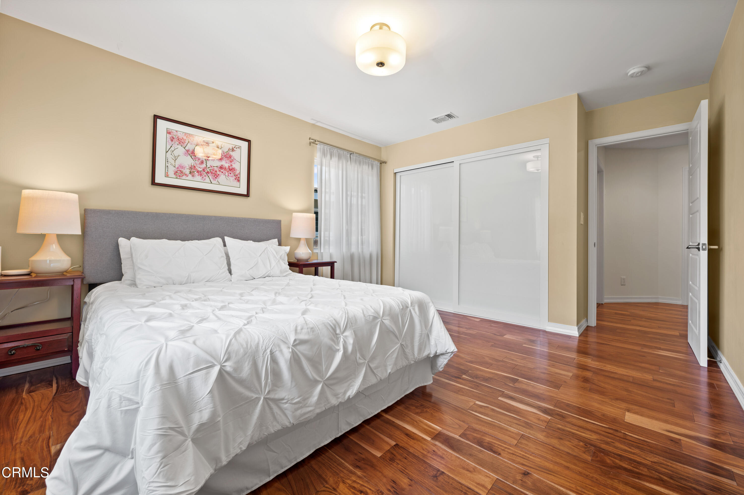 3770 Shadow Grove Road Pasadena, CA 91107 - Photo 31 of 61 a bedroom with a bed and wooden floor