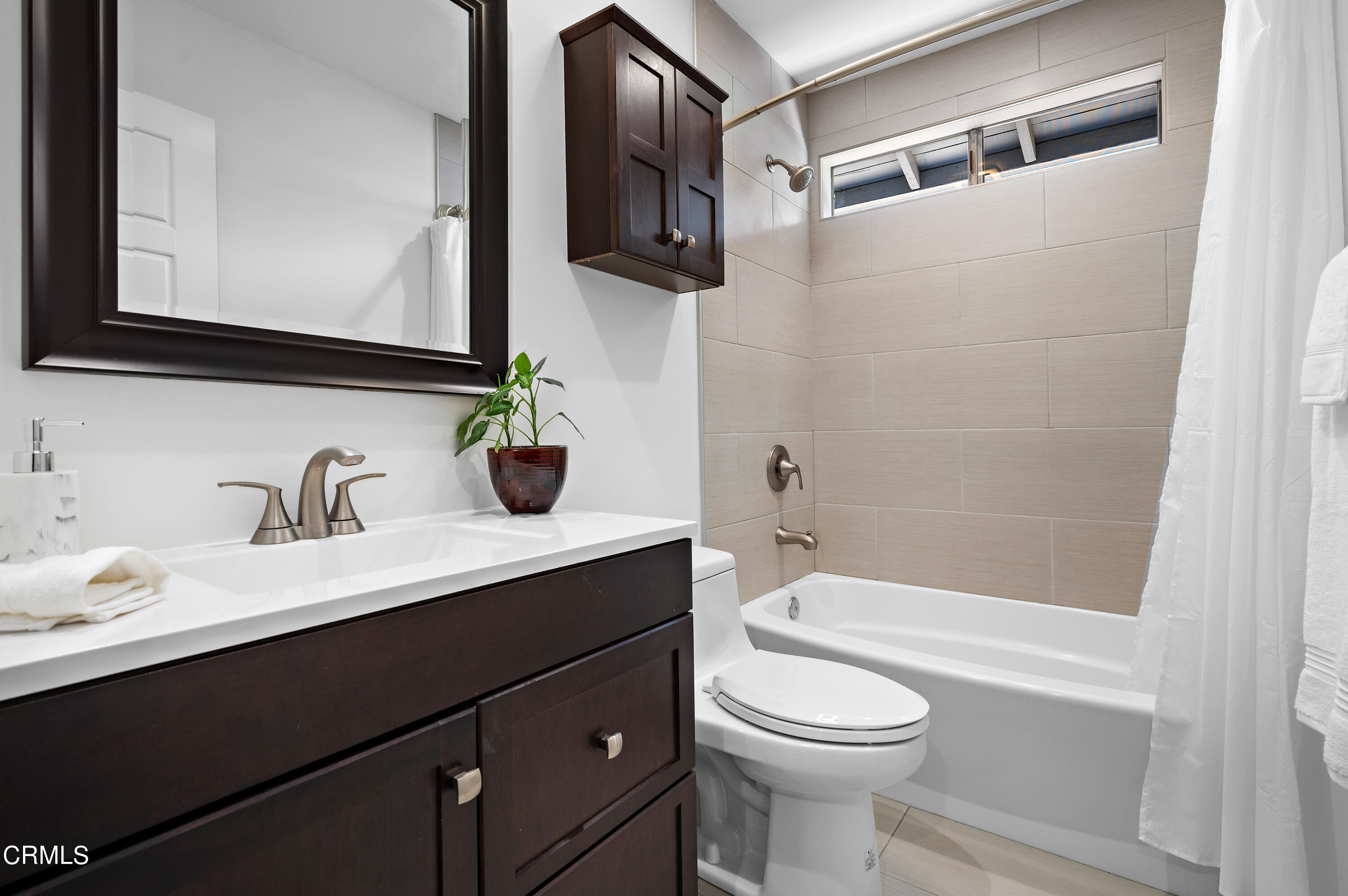 3770 Shadow Grove Road Pasadena, CA 91107 - Photo 32 of 61 a bathroom with a sink a toilet a mirror and shower