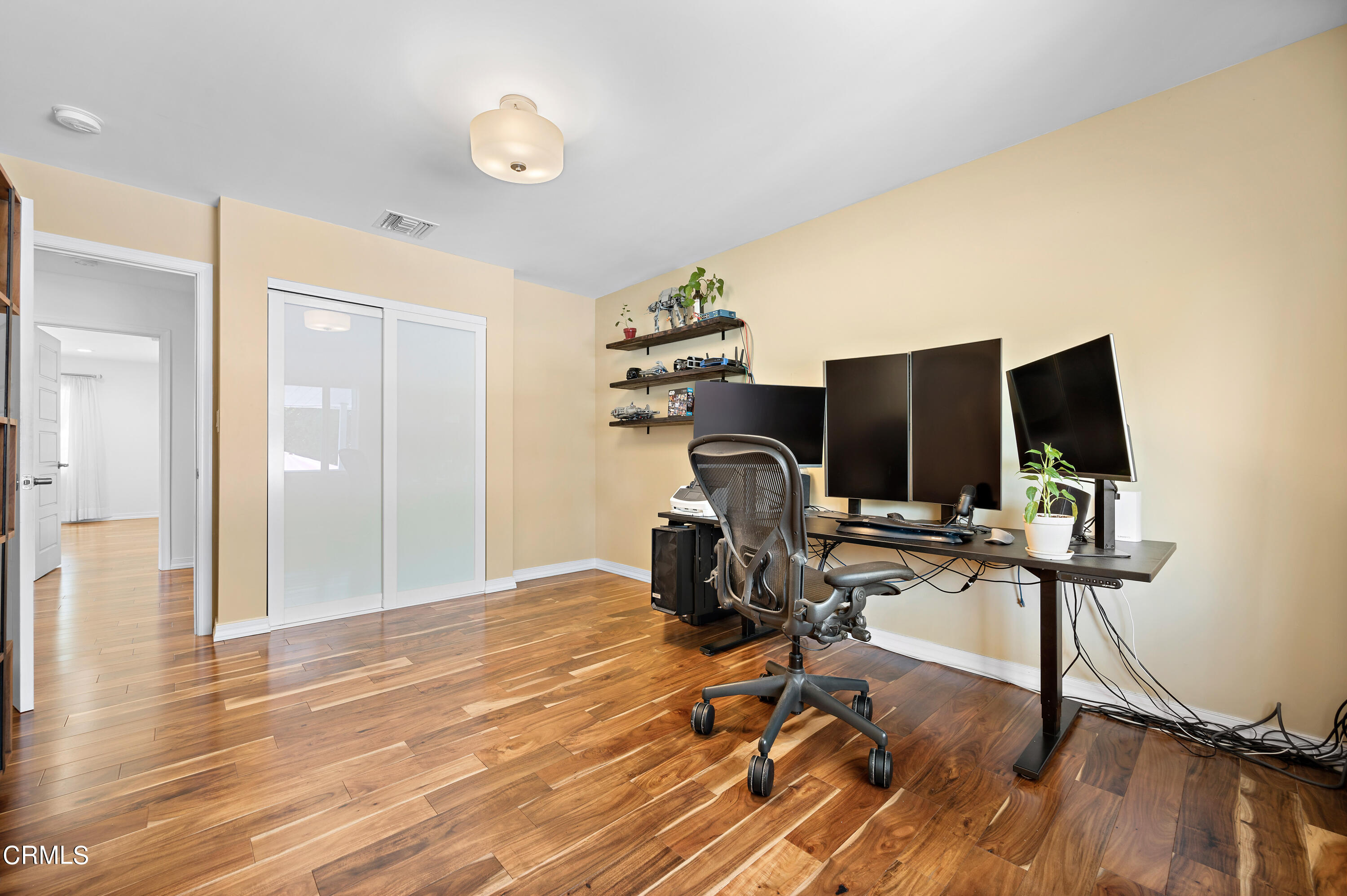 3770 Shadow Grove Road Pasadena, CA 91107 - Photo 34 of 61 a view of a workspace with furniture and wooden floor