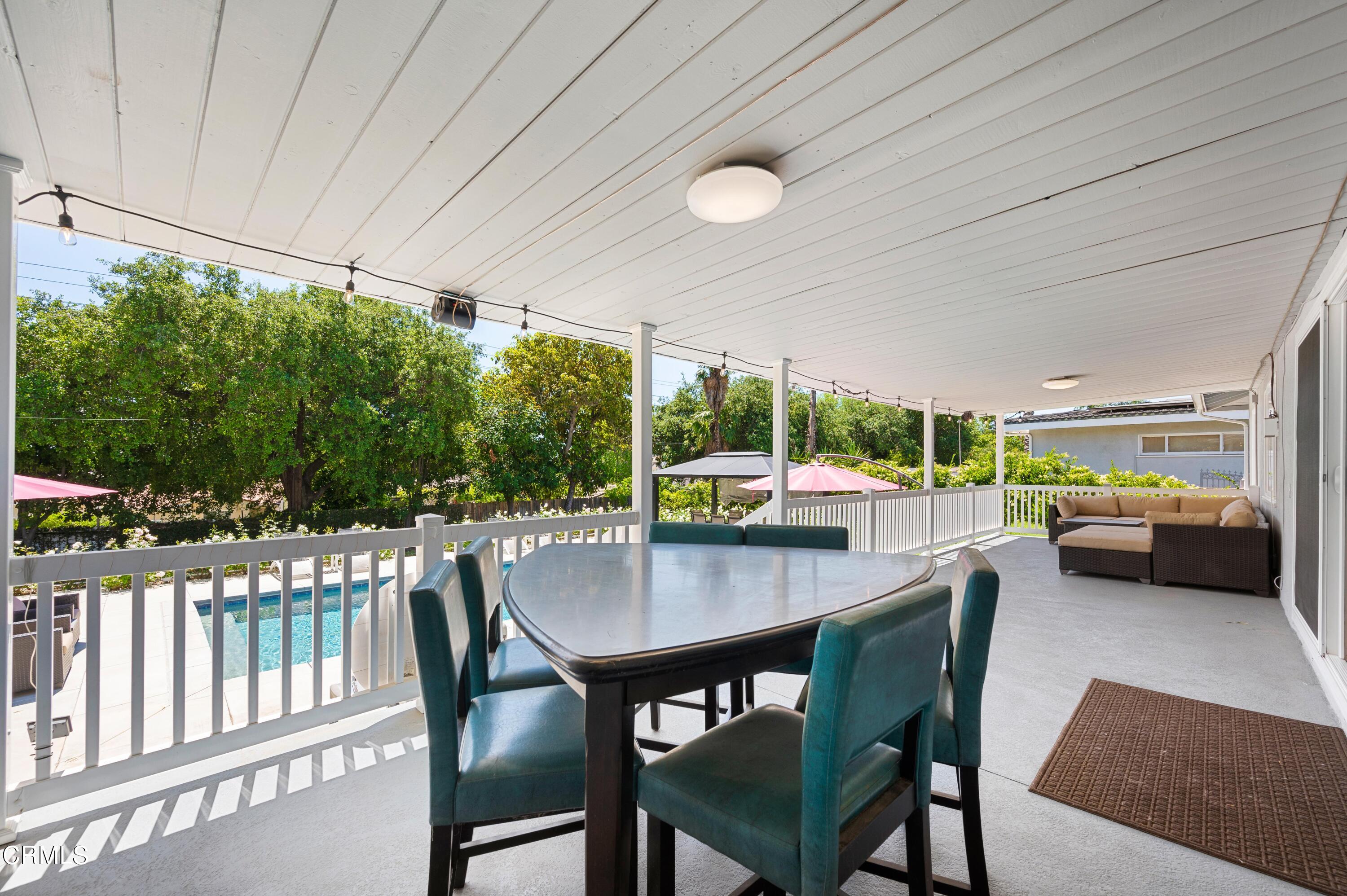 3770 Shadow Grove Road Pasadena, CA 91107 - Photo 35 of 61 a view of a patio with a table chairs and a backyard