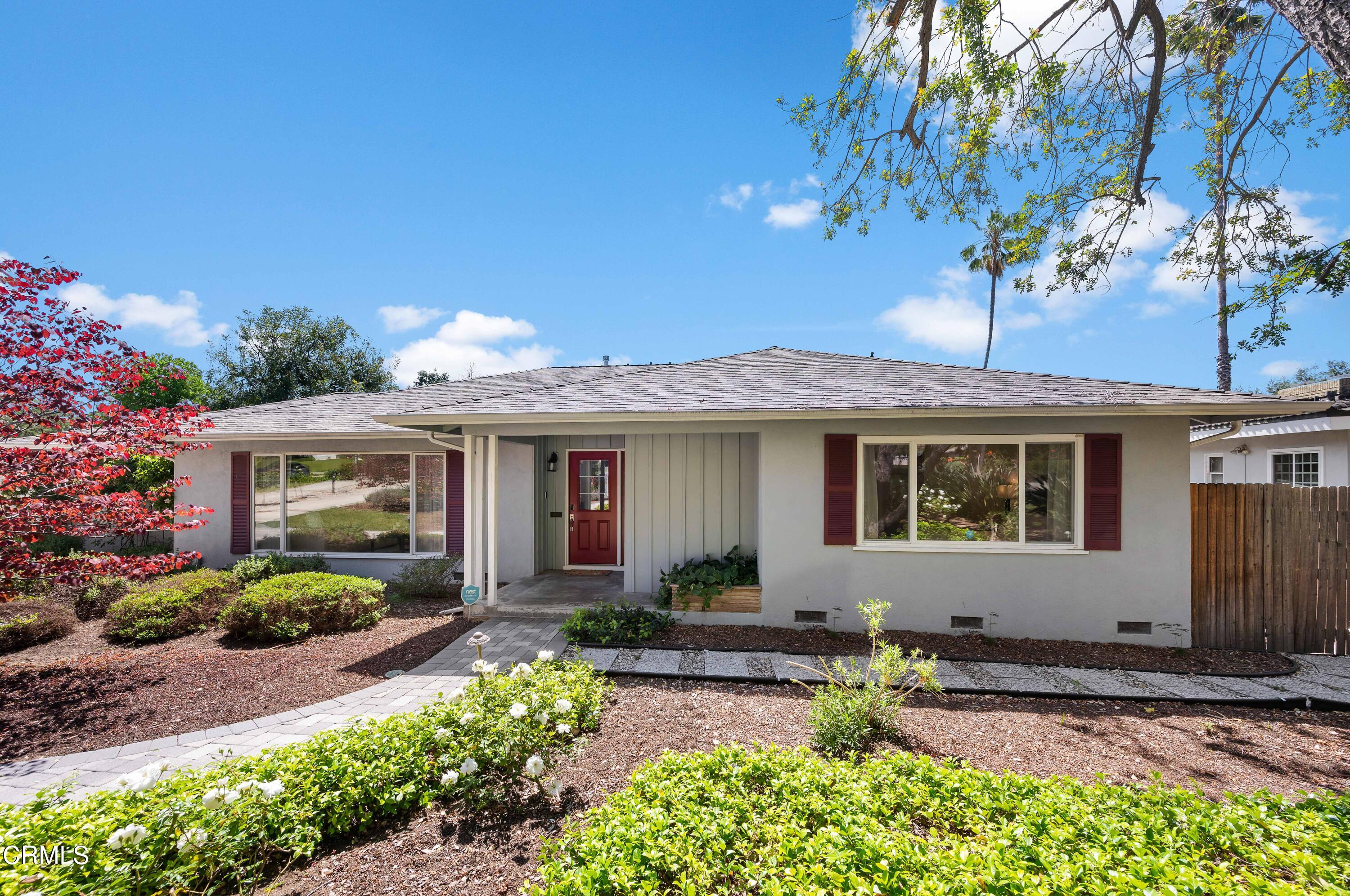 3770 Shadow Grove Road Pasadena, CA 91107 - Photo 7 of 61 a front view of a house with a yard and outdoor seating