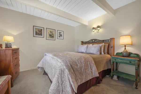 a bedroom with furniture and a window