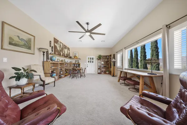 a room with furniture and a large window