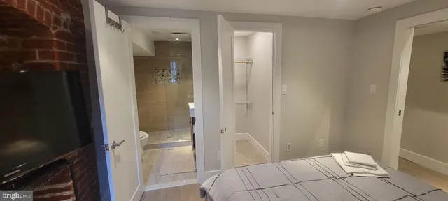 a bathroom with a sink and shower