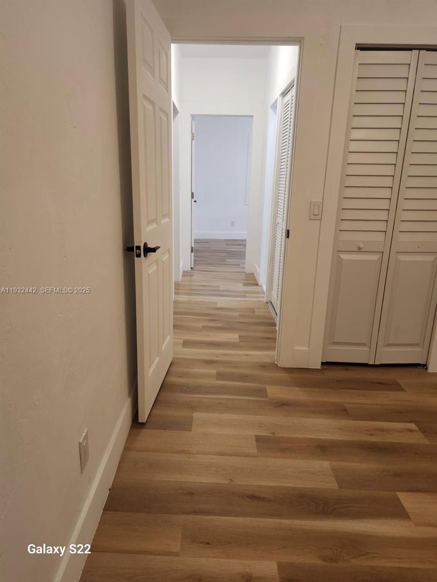 45 Northeast 60th Street Miami, FL 33137 - Photo 9 of 17 a view of a hallway with wooden floor