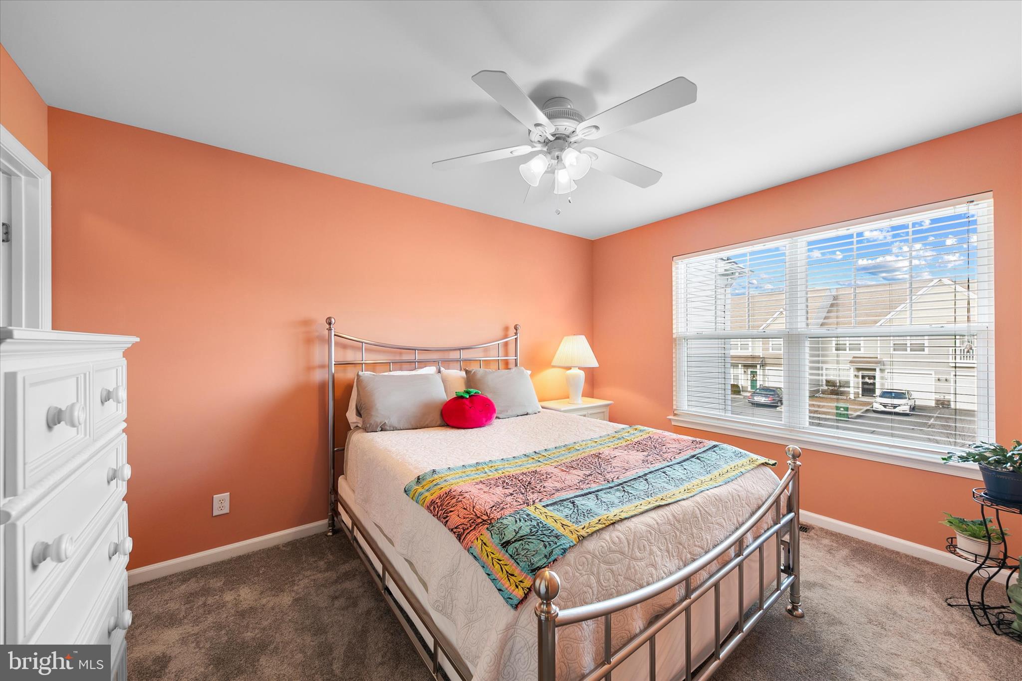 197 Intrepid Lane, Unit 1302 Berlin, MD 21811 - Photo 13 of 20 a bedroom with a bed and a chandelier