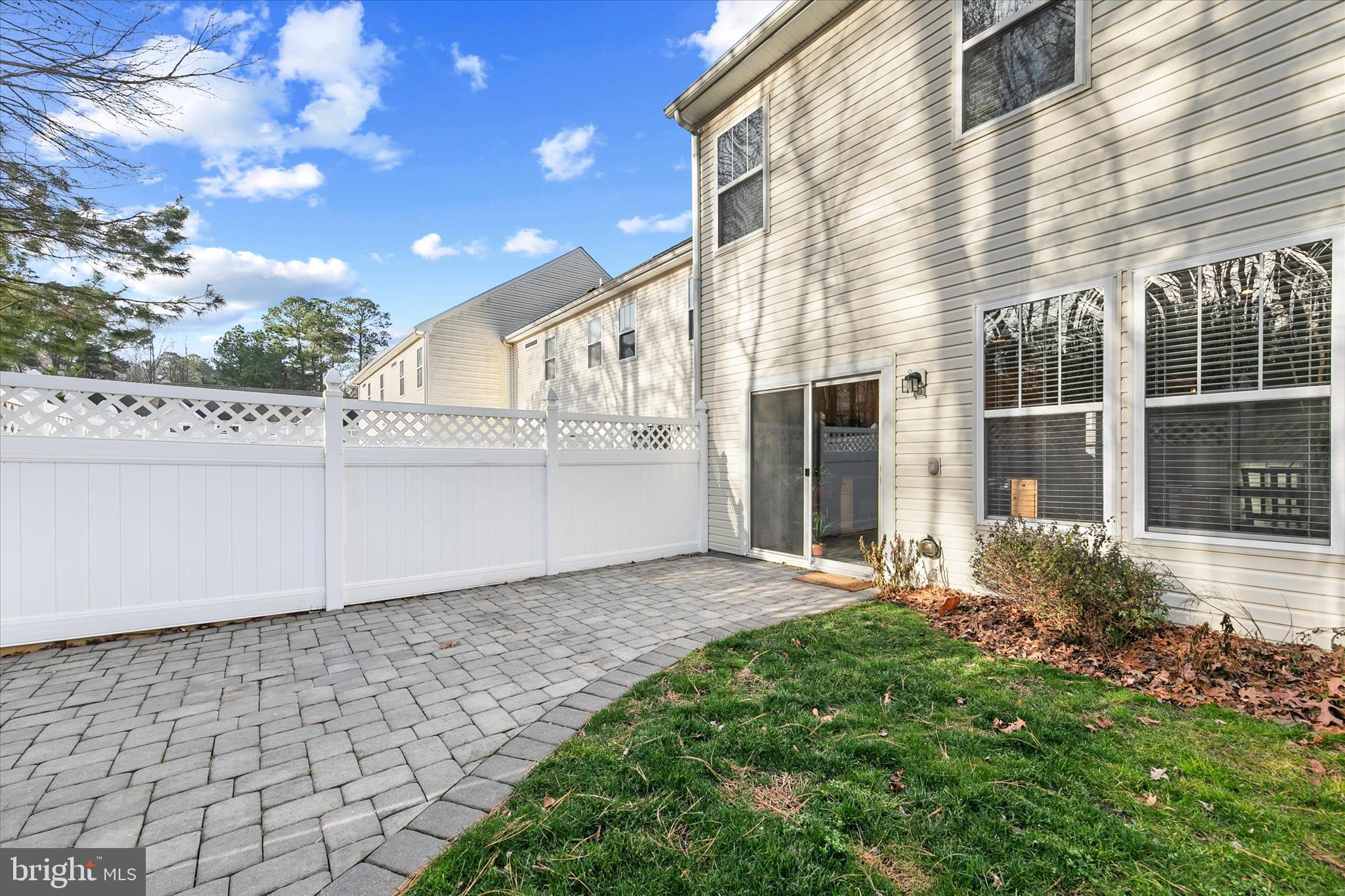 197 Intrepid Lane, Unit 1302 Berlin, MD 21811 - Photo 16 of 20 a view of a house with a yard