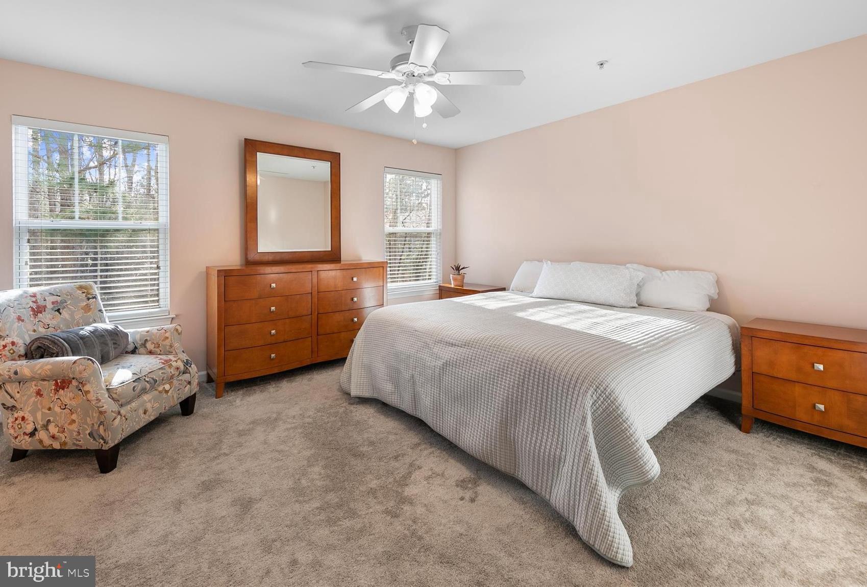 197 Intrepid Lane, Unit 1302 Berlin, MD 21811 - Photo 10 of 20 a bedroom with a bed and a window