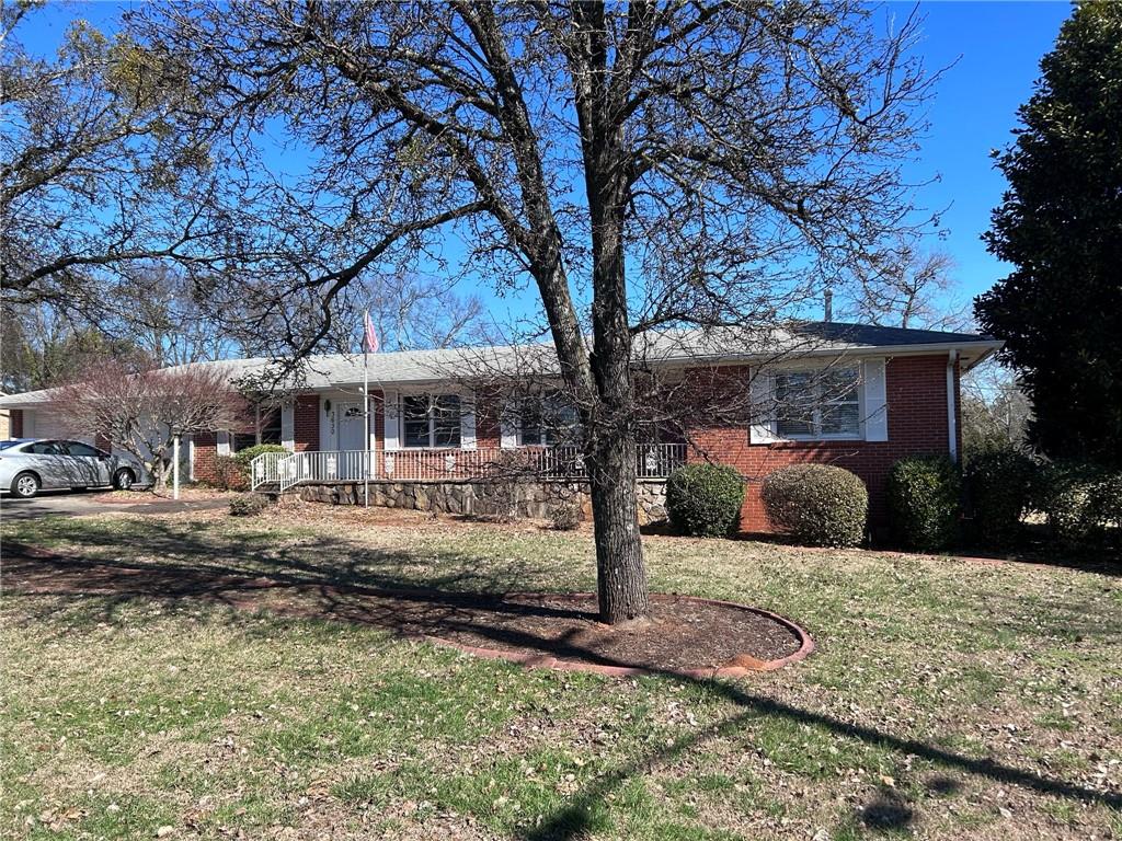 3630 Canton Road Marietta, GA 30066 - Photo 1 of 1 a front view of a house with garden