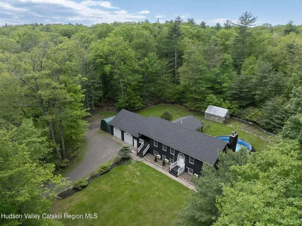an aerial view of a house having yard