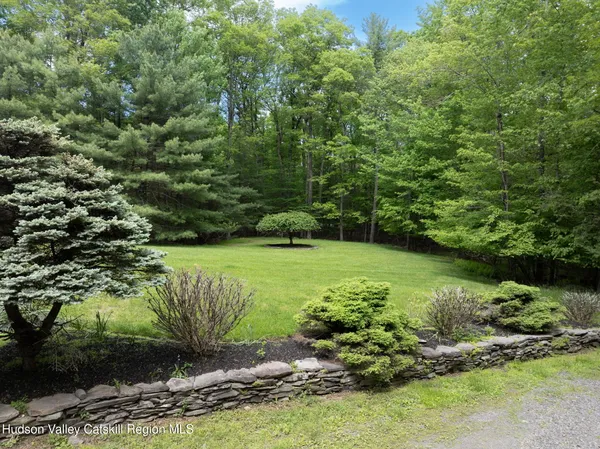 a view of a garden with a lake