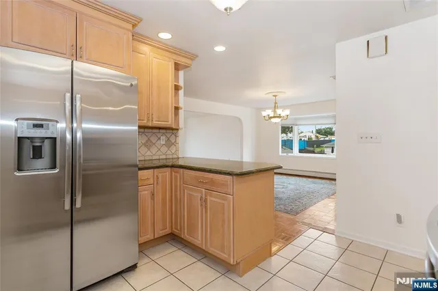 an empty room with a ceiling fan and a window