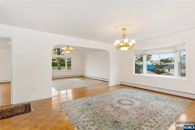 a view of a kitchen with a sink and cabinets