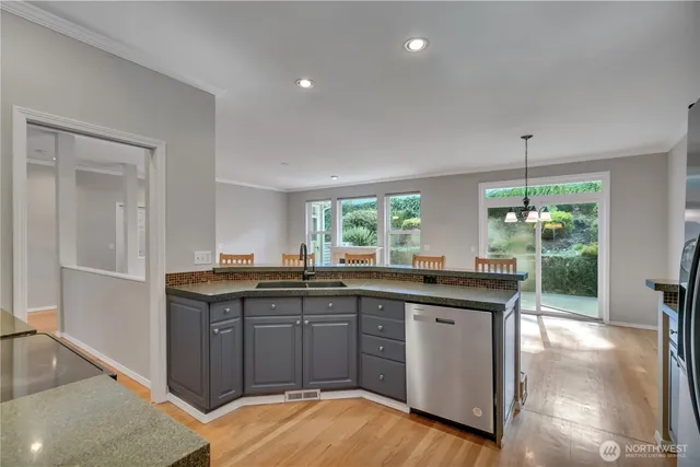 a kitchen with a sink stove and microwave