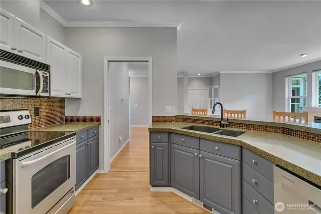 a kitchen with a stove and a microwave