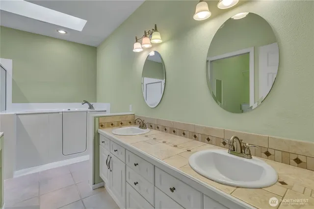 a bathroom with a sink and shower
