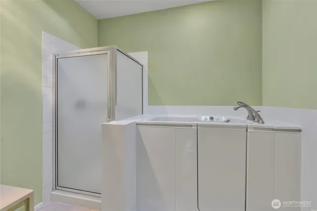 a view of walk in closet with empty racks