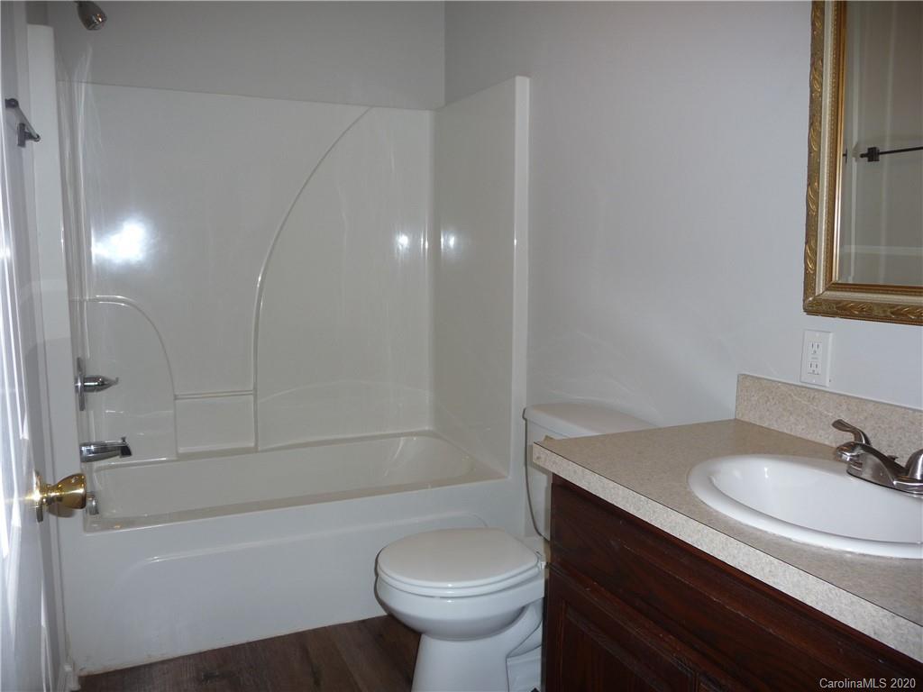 4222 Richardson Road Monroe, NC 28112 - Photo 12 of 21 a bathroom with a sink a toilet and bathtub