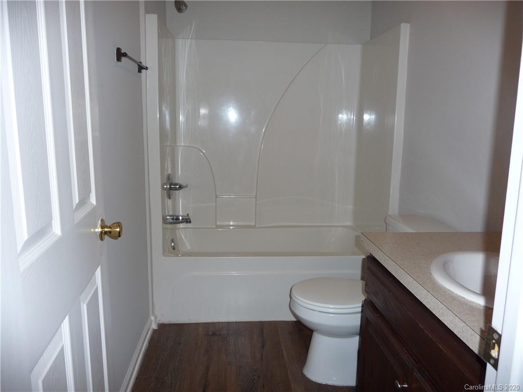 4222 Richardson Road Monroe, NC 28112 - Photo 13 of 21 a bathroom with a sink a toilet and shower