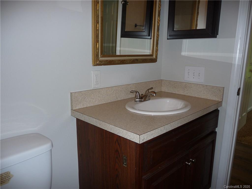 4222 Richardson Road Monroe, NC 28112 - Photo 14 of 21 a bathroom with a sink and a mirror