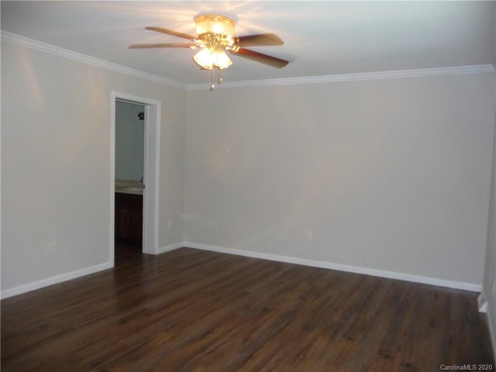 4222 Richardson Road Monroe, NC 28112 - Photo 15 of 21 a view of an empty room with wooden floor