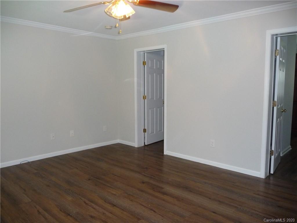 4222 Richardson Road Monroe, NC 28112 - Photo 16 of 21 a view of an empty room with wooden floor