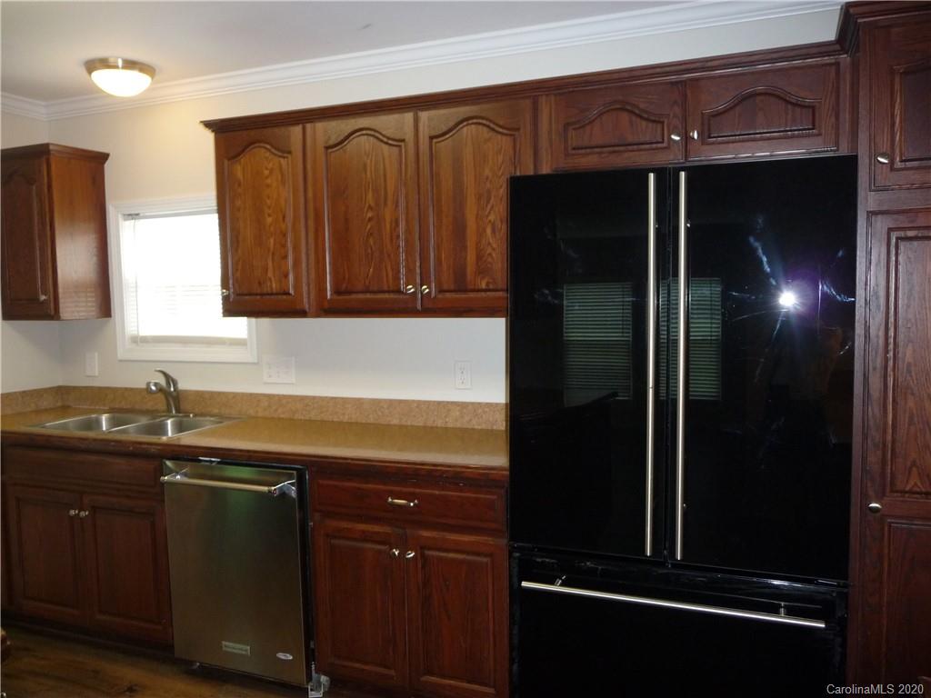 4222 Richardson Road Monroe, NC 28112 - Photo 7 of 21 a kitchen with a sink and a refrigerator