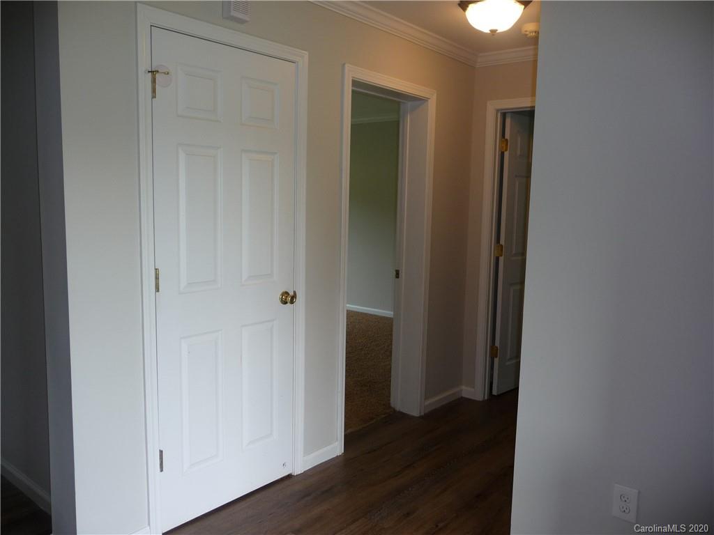 4222 Richardson Road Monroe, NC 28112 - Photo 9 of 21 a view of a hallway with wooden floor